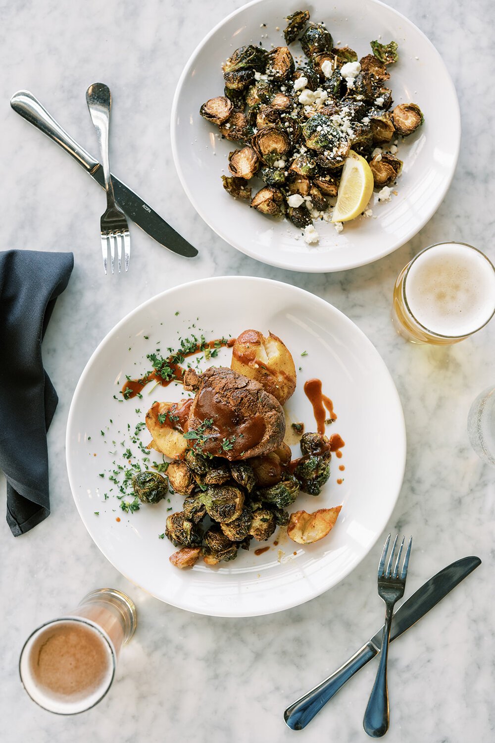 Featured: Seared sirloin entree and crispy brussels sprouts appetizer  PC: INSTAGRAM // @lord.and.Co.  WEBSITE // https://samanthalord.co/